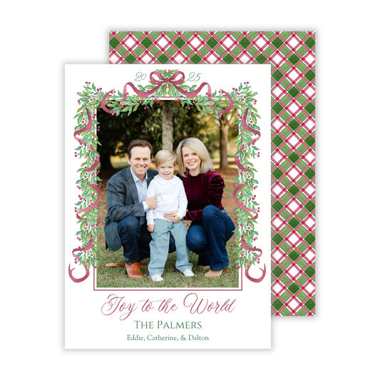 personalized photo christmas card with watercolor garland with bows and Joy to the World text and a festive green & red back design, ShooFly Paper Co. Auburn, Alabama